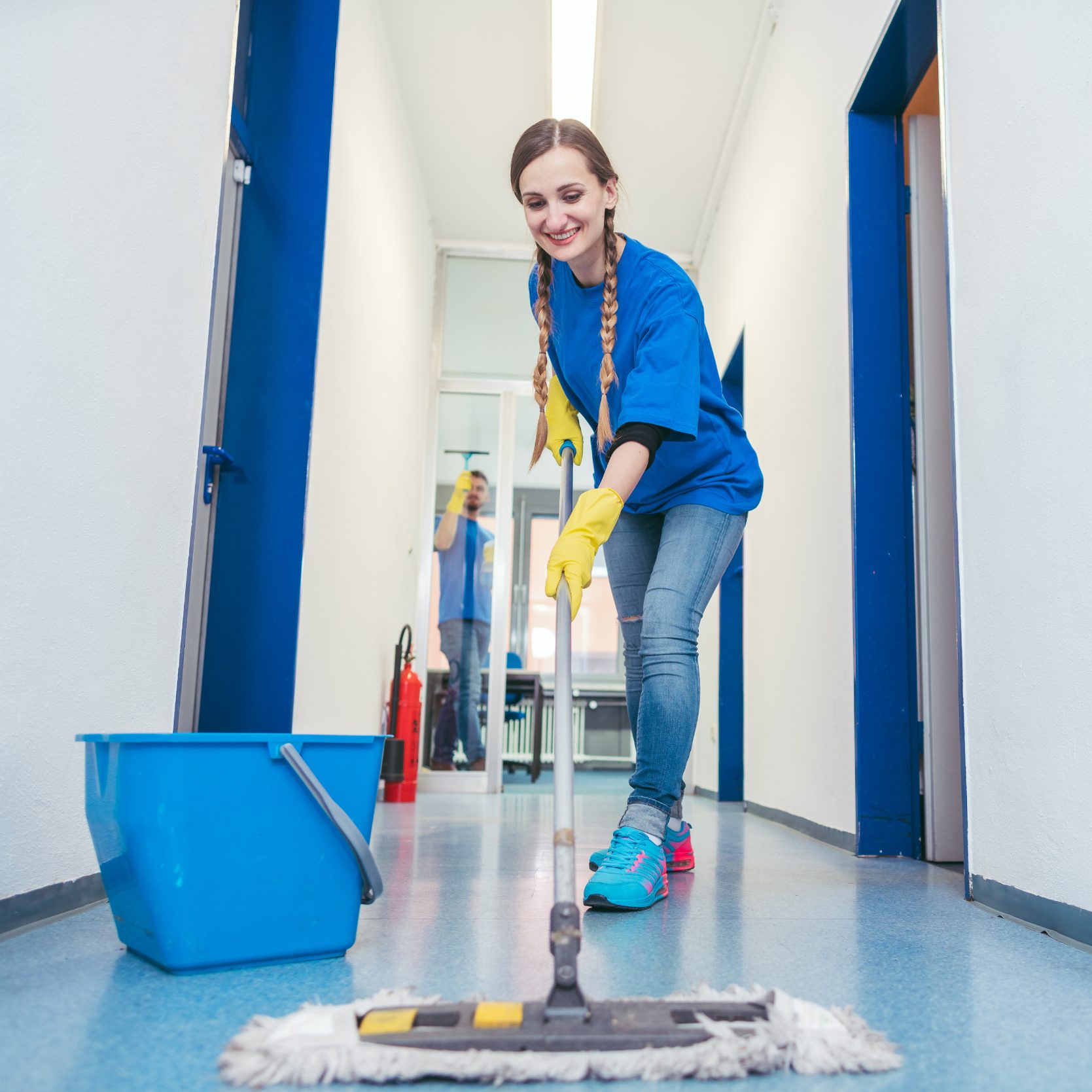 Woman mopping the floor